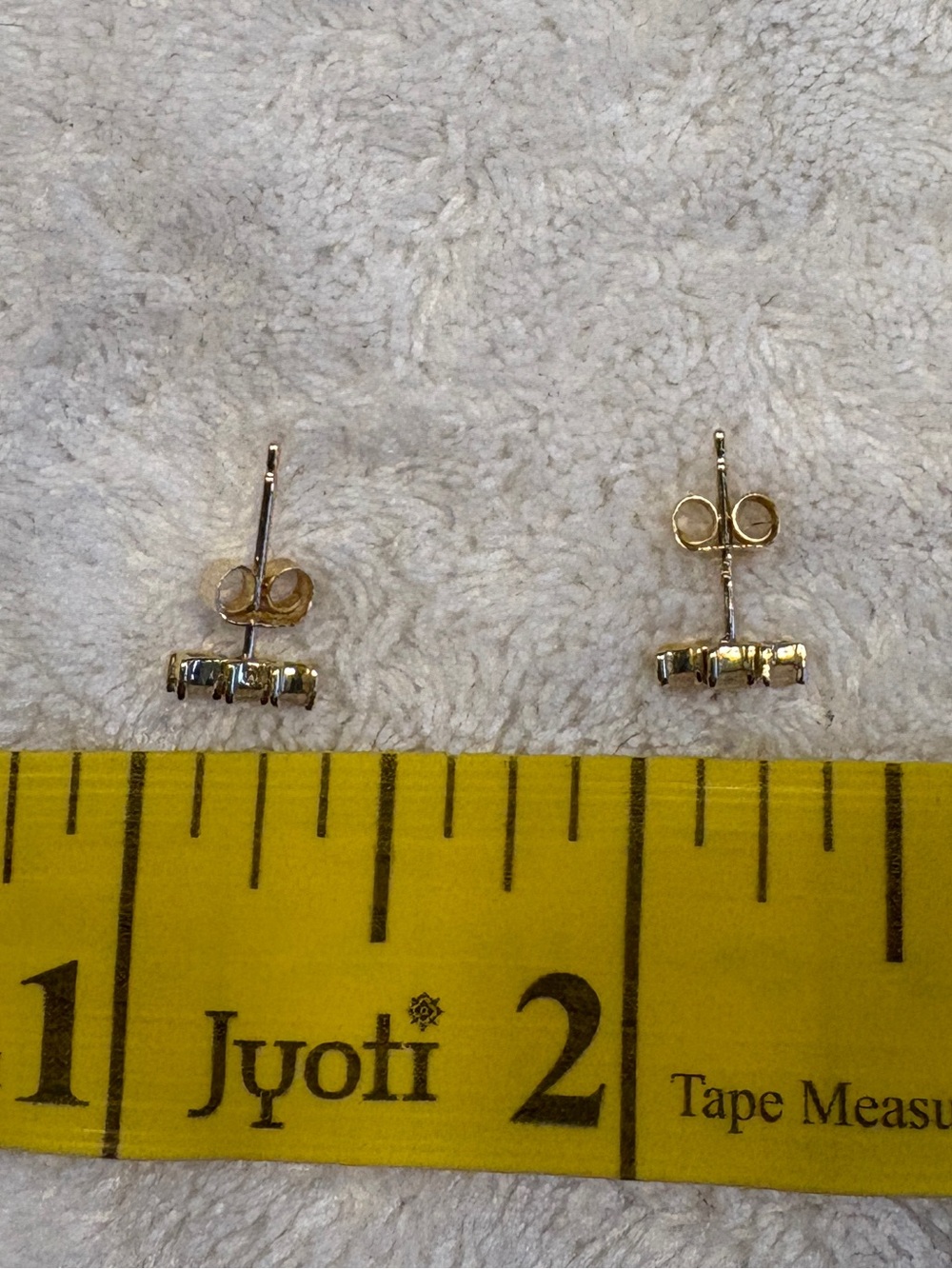 Mejuri white sapphire line stud earrings in gold - Picture 5 of 7